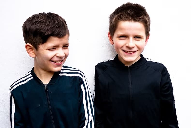 Children smiling together at a community program