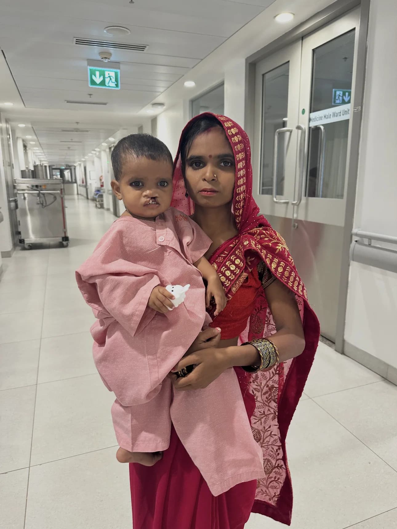 Mother holding her child during a cleft surgery mission in Faridabad, India