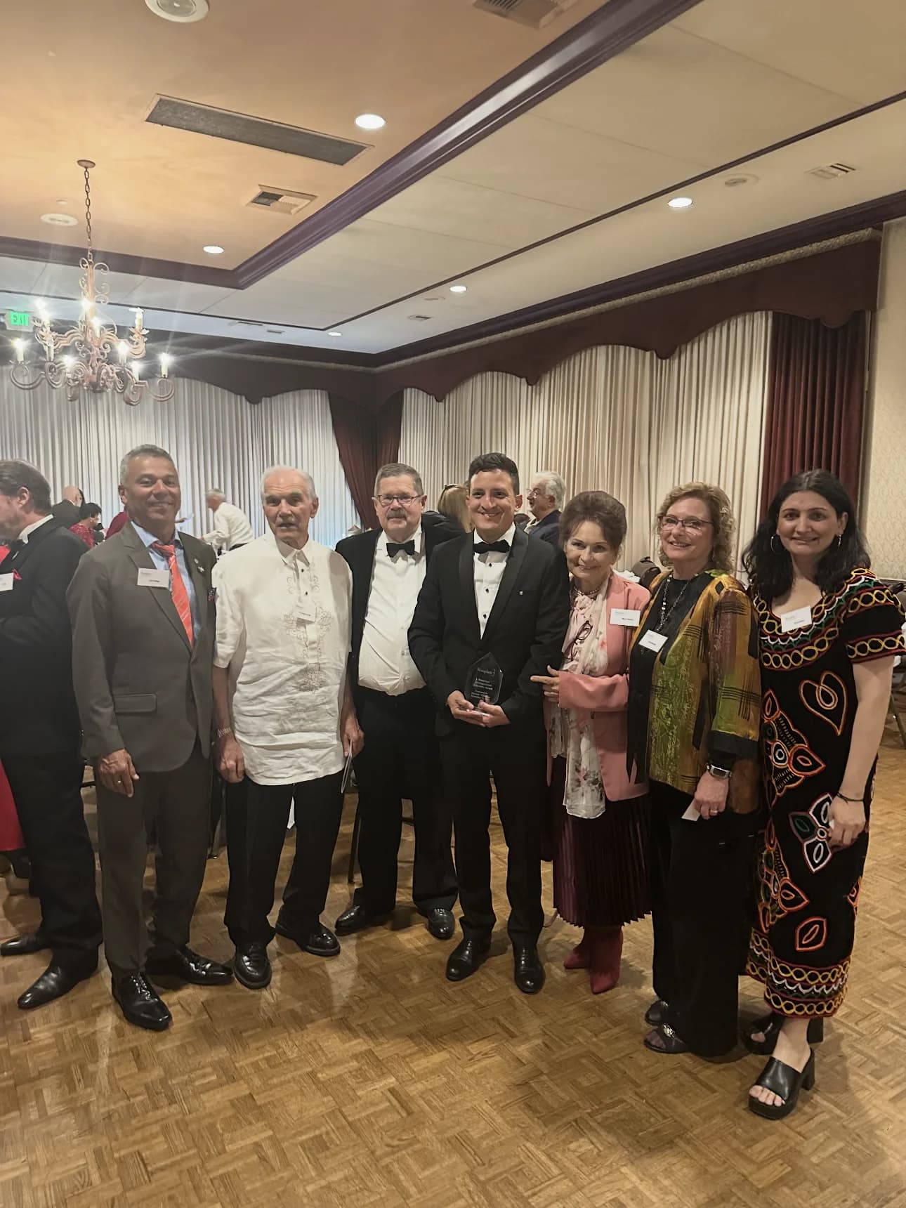 Save The Foster with community and humanitarian leaders at a recognition gathering